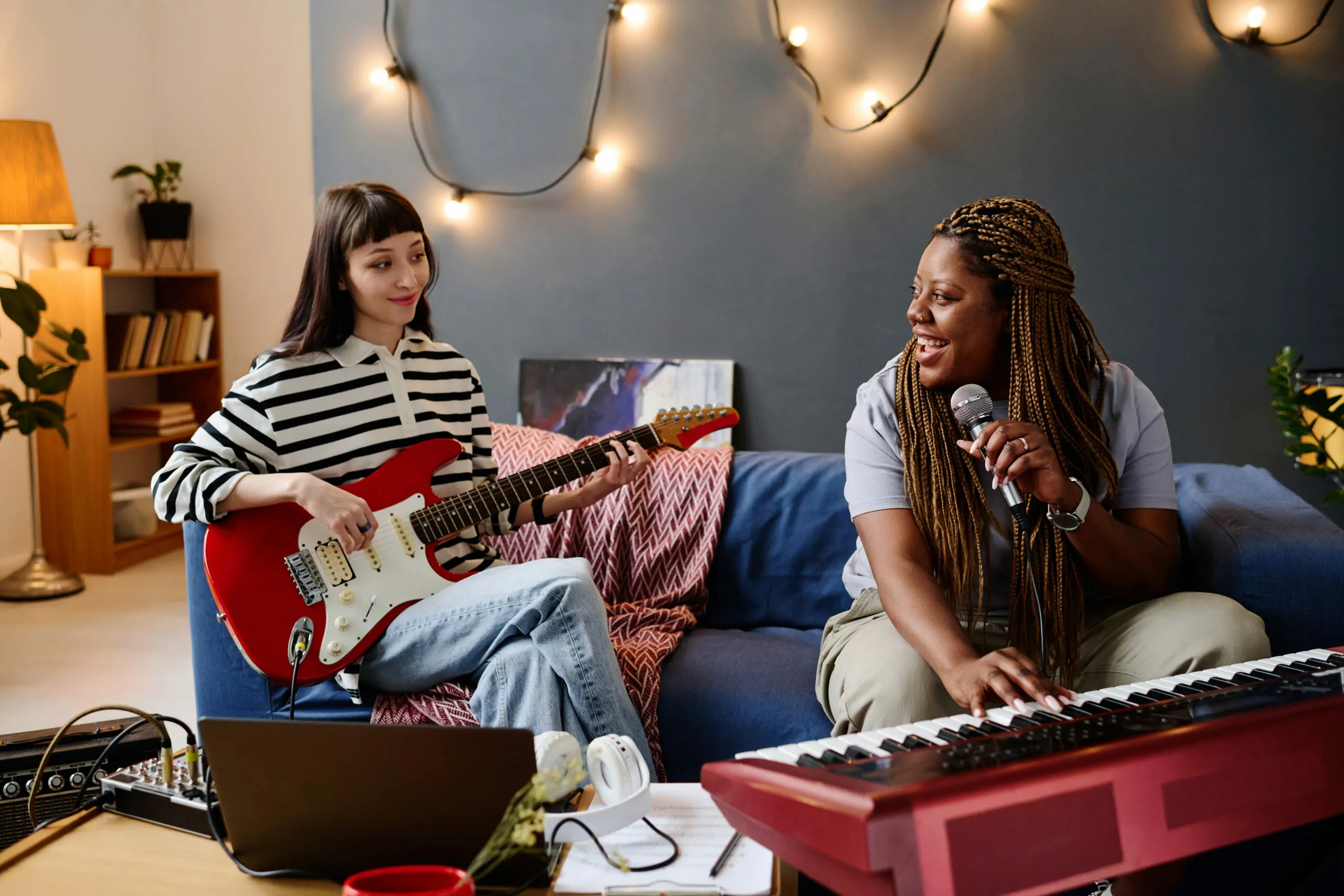 Girls playing music together in studio
